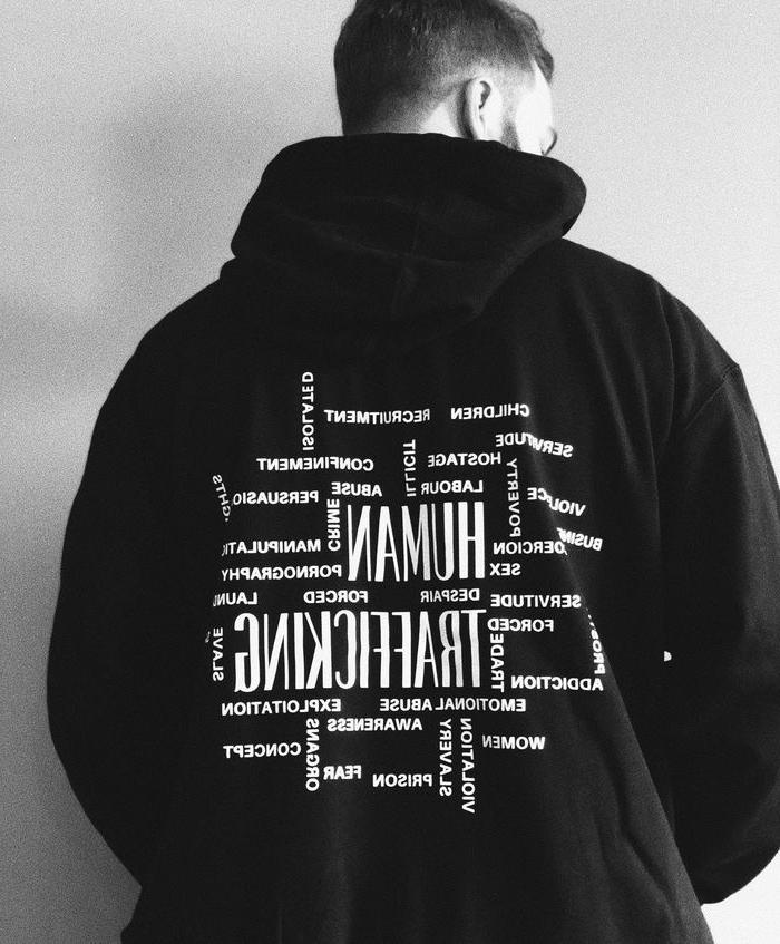 Person showing the back of their hoodie 