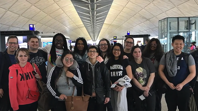 Students smiling in airport